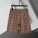 Burberry - Shorts avec motif monogramme et bande colorée - Marron