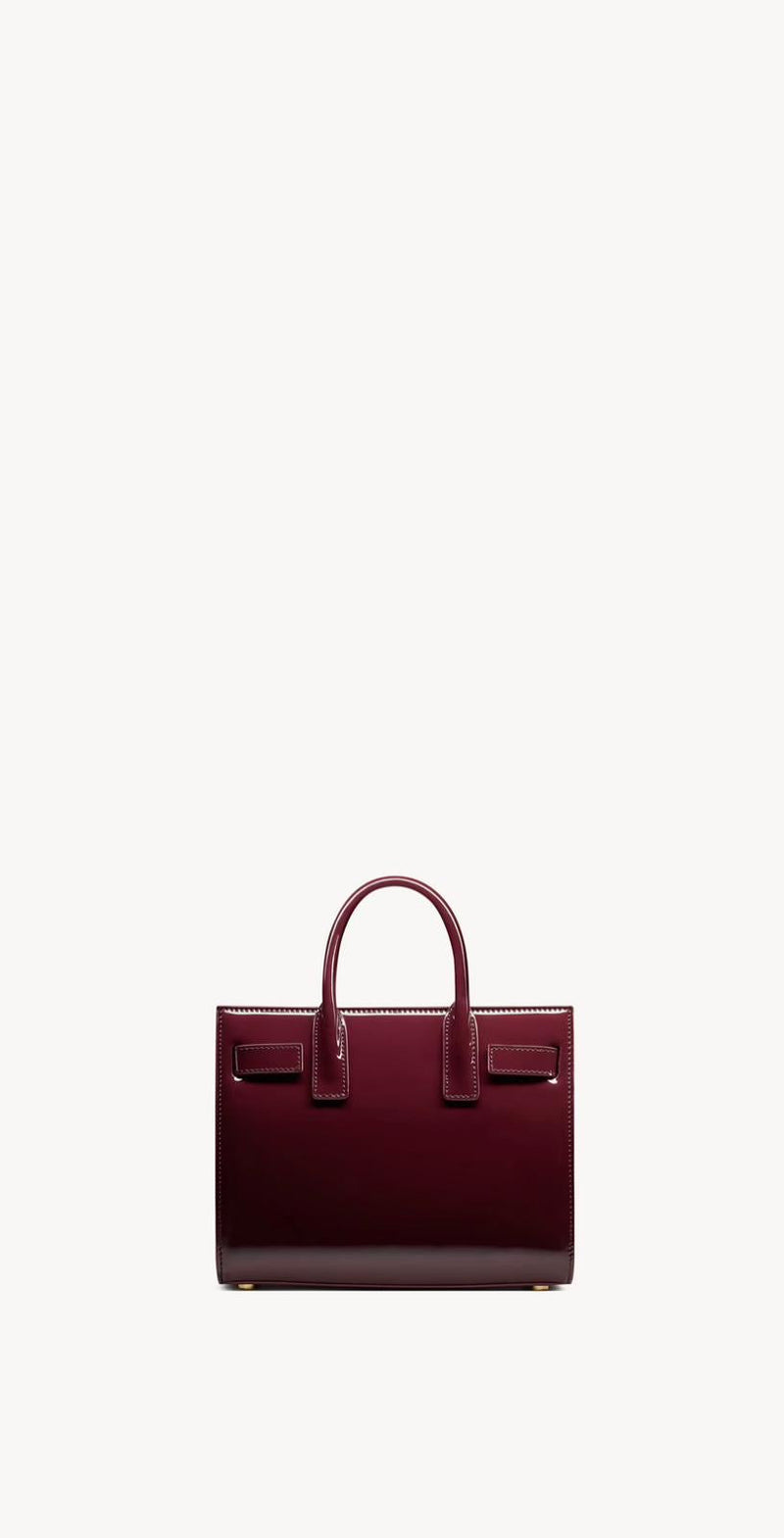 Yves Saint Laurent - SAC DE JOUR NANO EN CUIR VERNI
DARK RED WINE