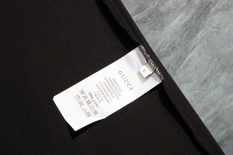 Gucci - T-shirt avec un design de papillon et logo Gucci - Noir