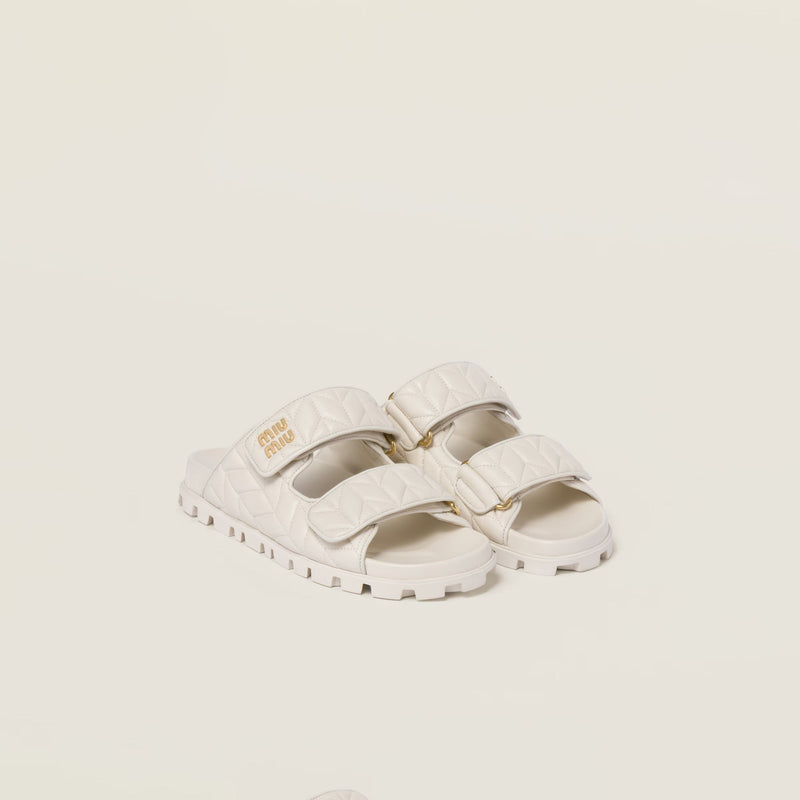 Miu Miu - Mules en cuir nappa matelassé Blanc