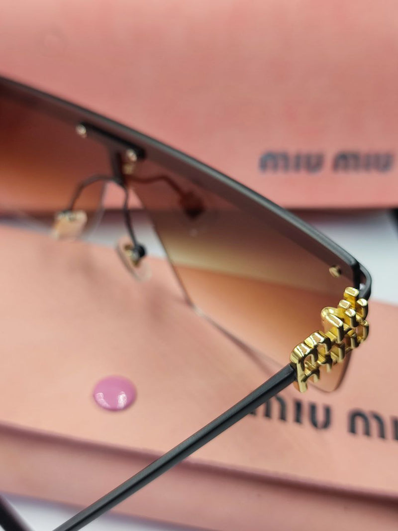Lunette Miumiu en Noir et Gold
