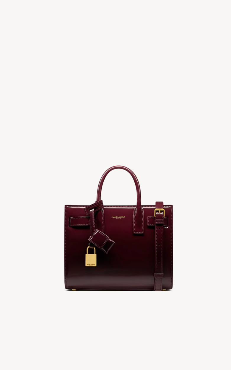 Yves Saint Laurent - SAC DE JOUR NANO EN CUIR VERNI
DARK RED WINE