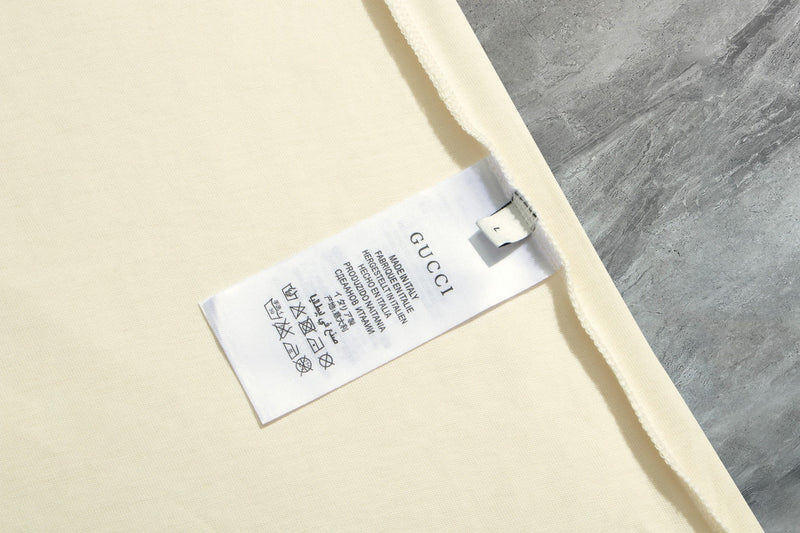 Gucci - T-shirt avec un design illustré et logo Gucci - Crème