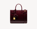 Yves Saint Laurent - SAC DE JOUR NANO EN CUIR VERNI
DARK RED WINE