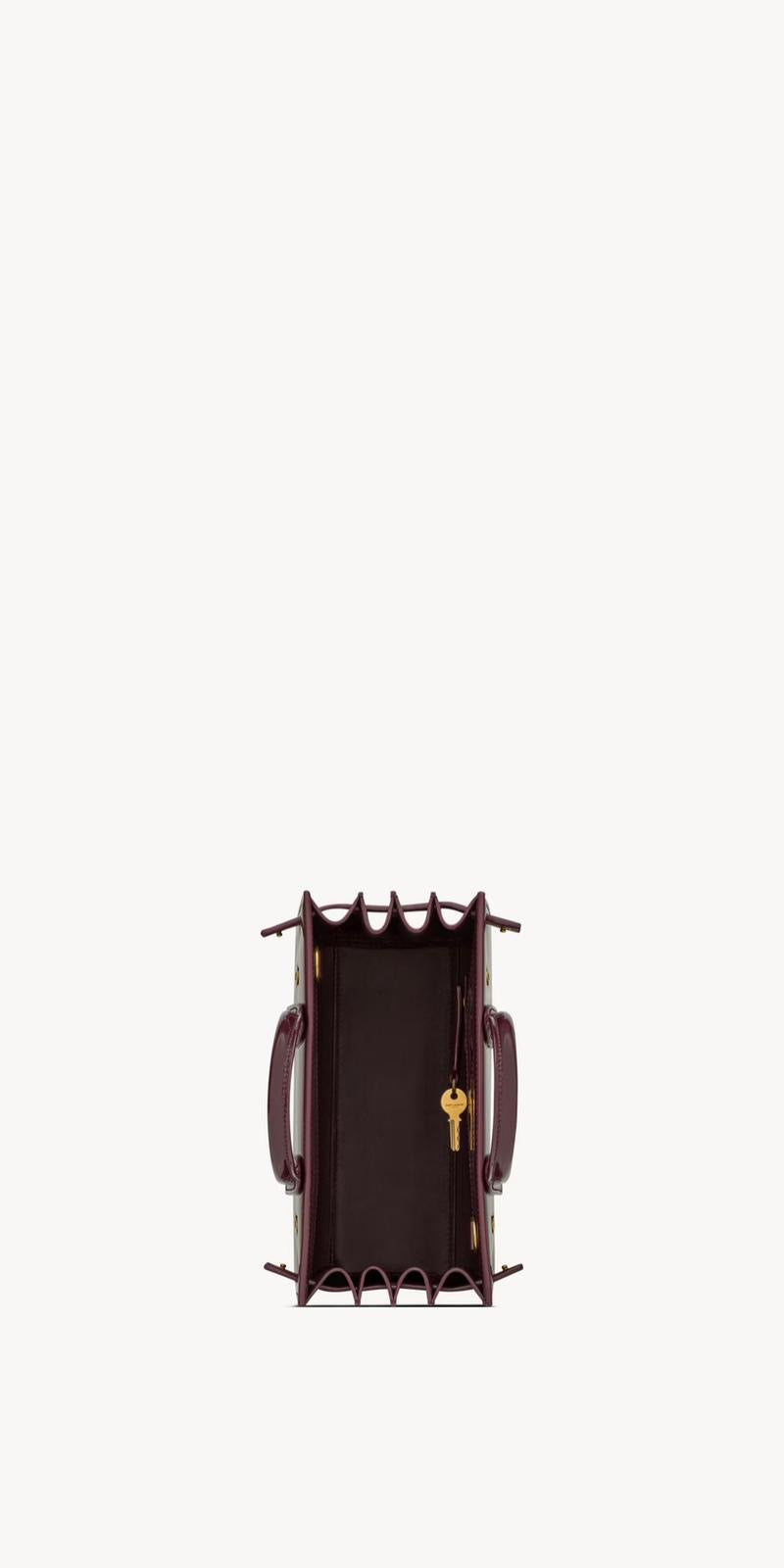 Yves Saint Laurent - SAC DE JOUR NANO EN CUIR VERNI
DARK RED WINE