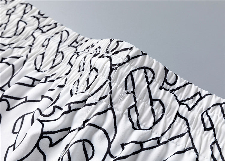 Burberry - Shorts Burberry avec motif monogramme noir et blanc - Blanc