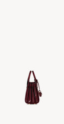 Yves Saint Laurent - SAC DE JOUR NANO EN CUIR VERNI
DARK RED WINE