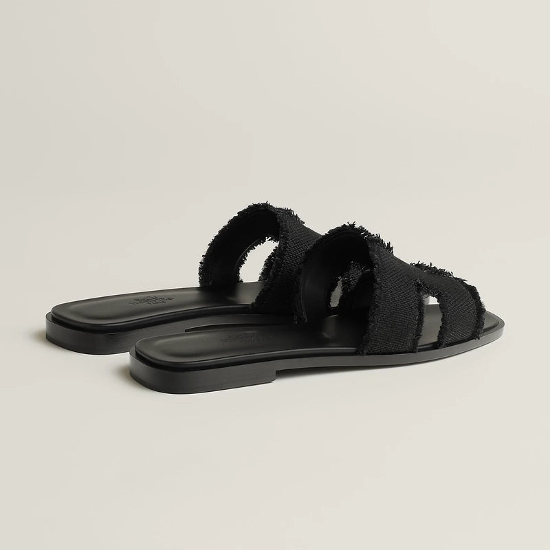 Hermès - Sandales Oran Noir en toile H effrangée