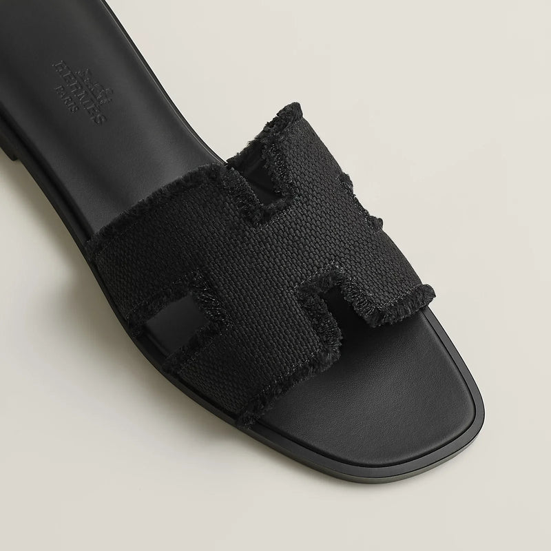 Hermès - Sandales Oran Noir en toile H effrangée