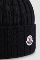 Moncler - Bonnet en laine avec pompon Noir